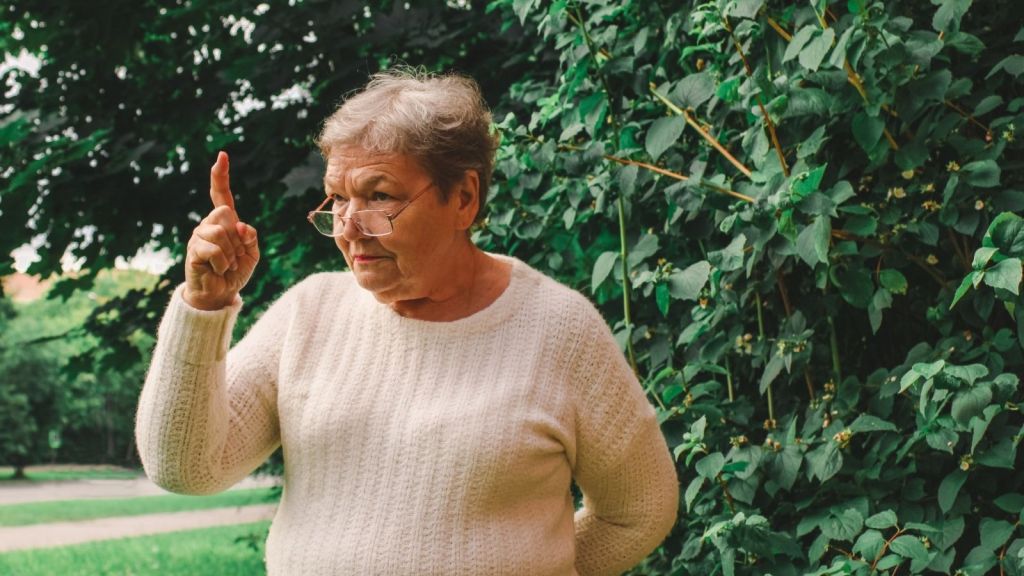 older woman yelling outdoors