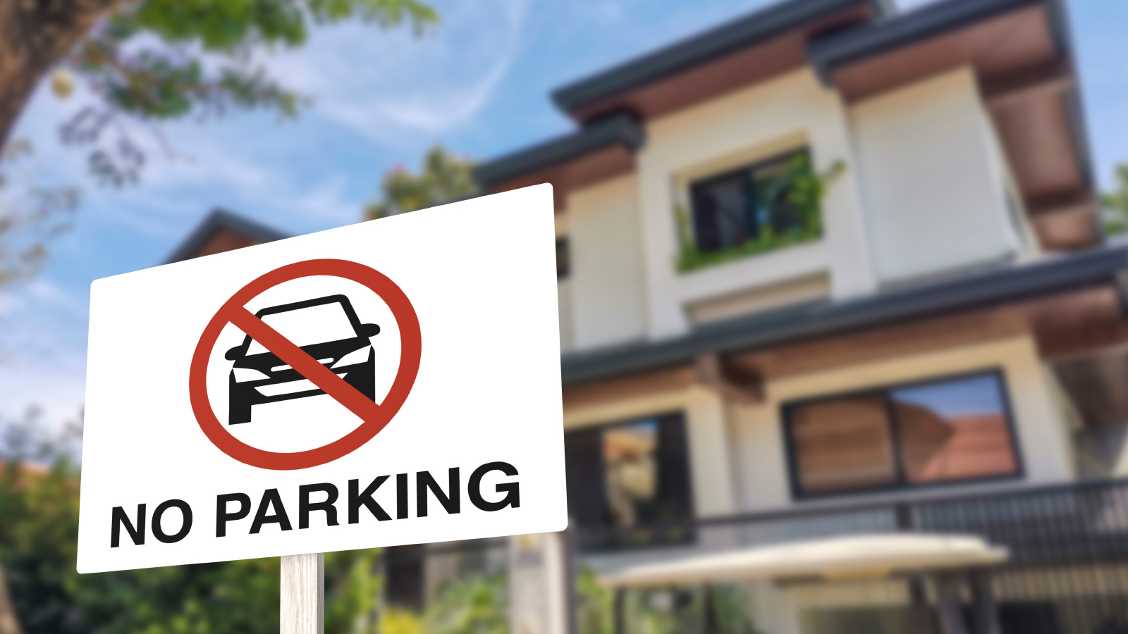 No parking sign in front of a home