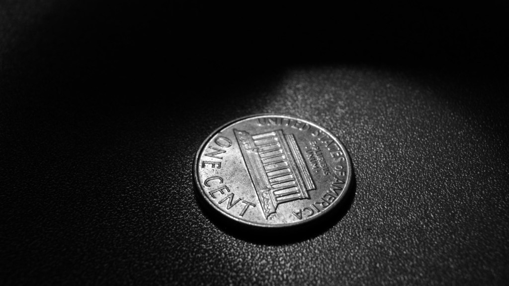 A single penny in black and white