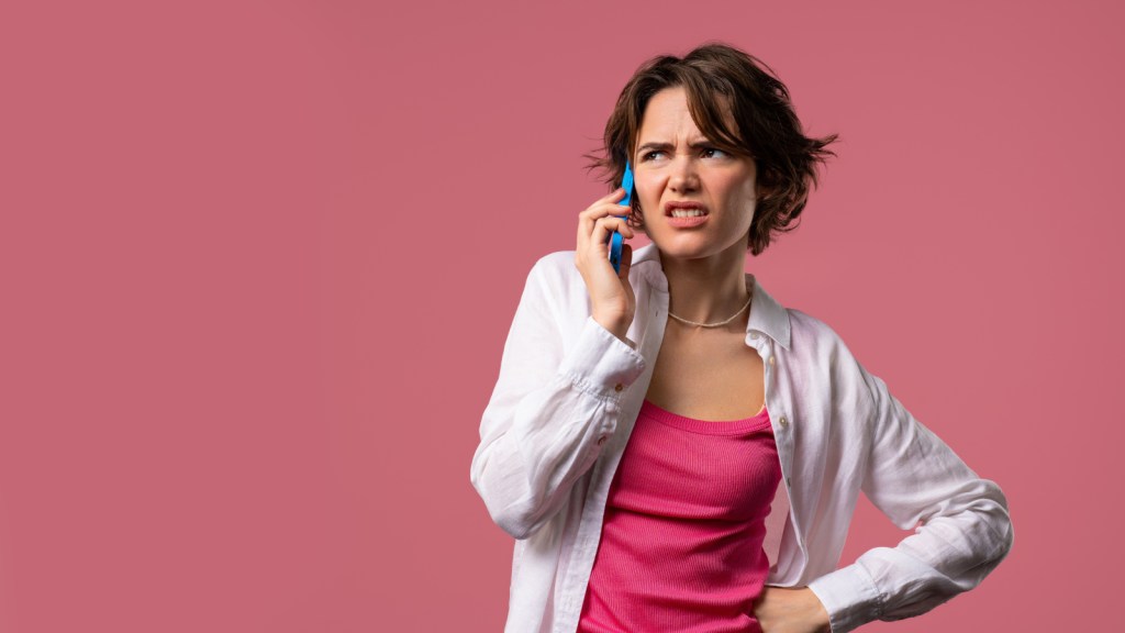 An upset young woman on a phone