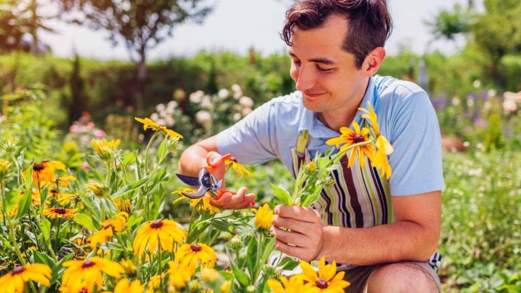 young man planting flowers