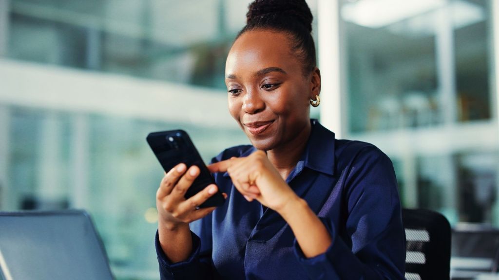 businesswoman smiling at phone