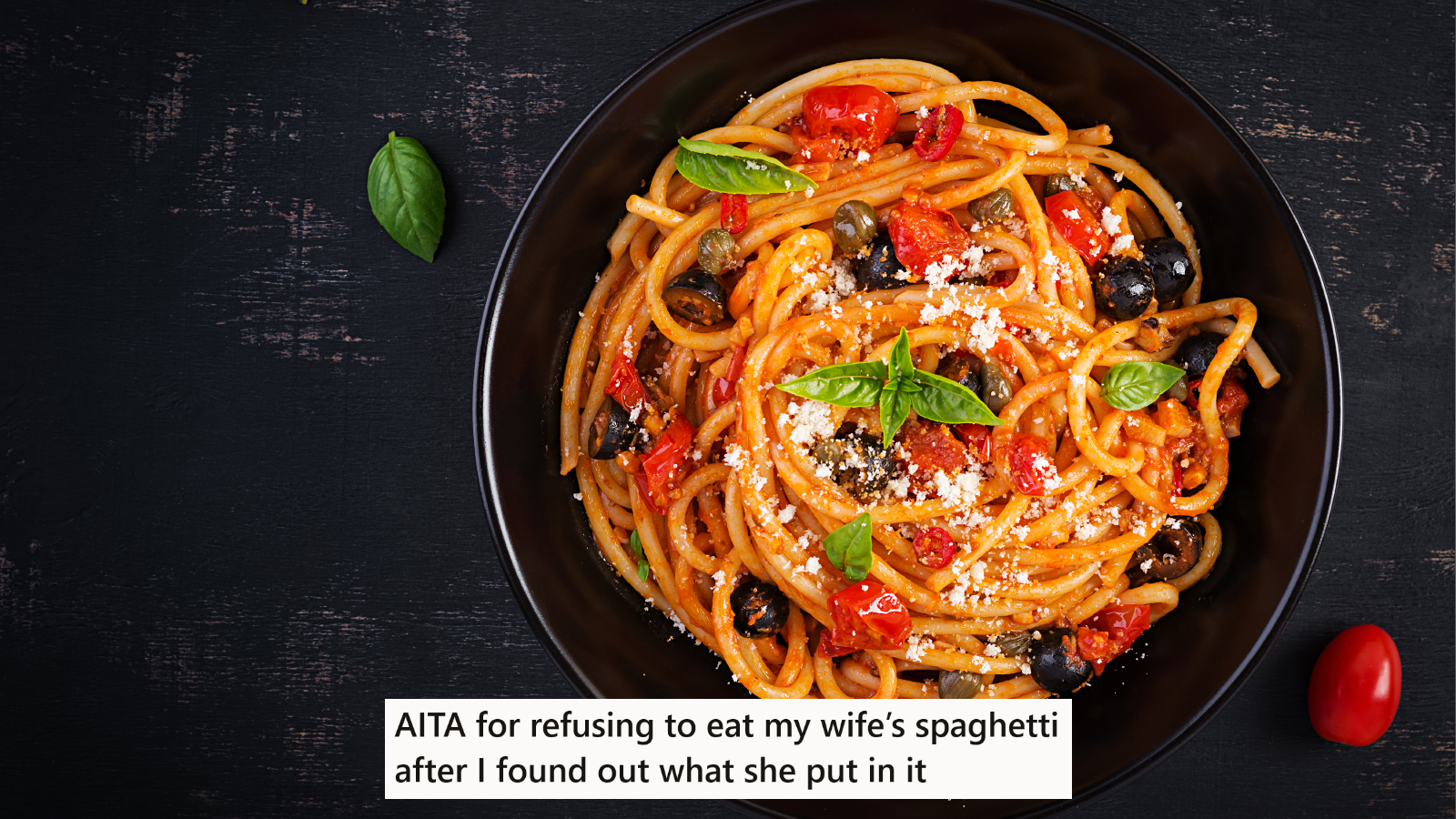 A bowl of spaghetti on a black table