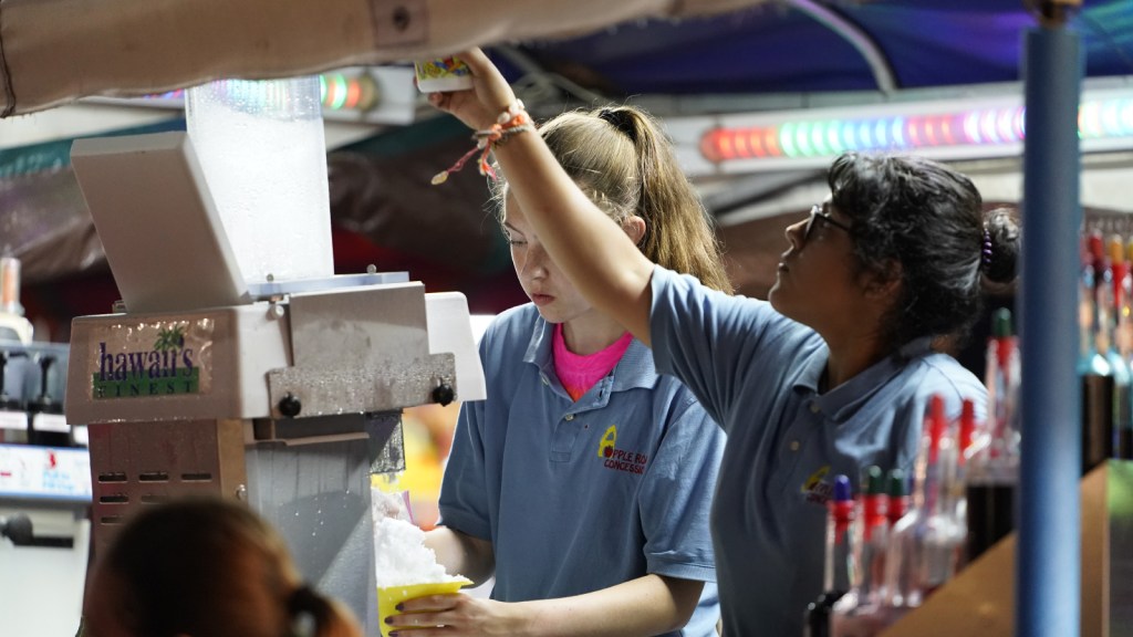 Young women working at a concession stand