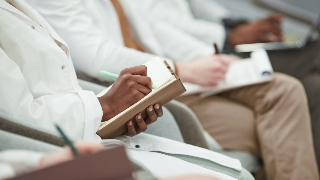 Medical students taking notes