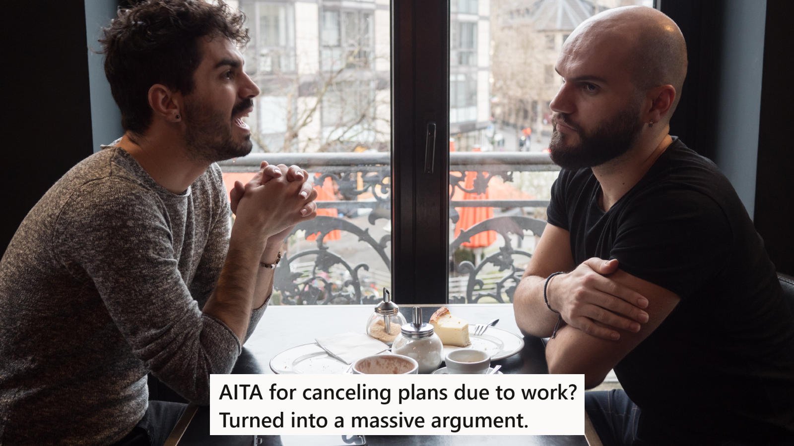 Two men arguing at a restaurant table