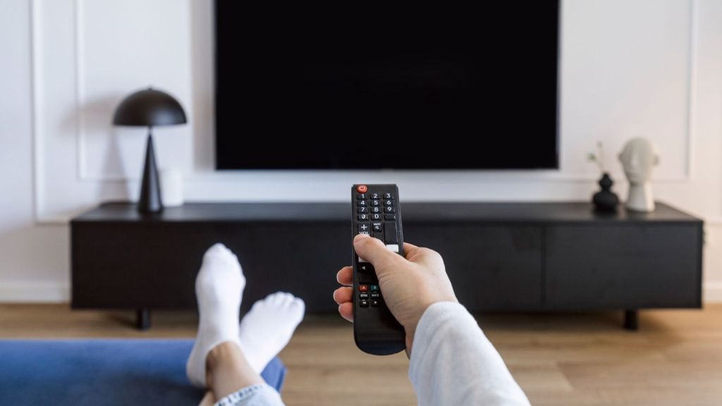 sitting in front of black tv