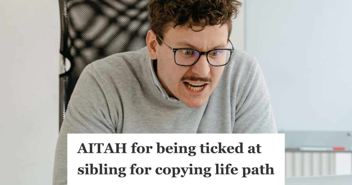 upset man in gray sweater