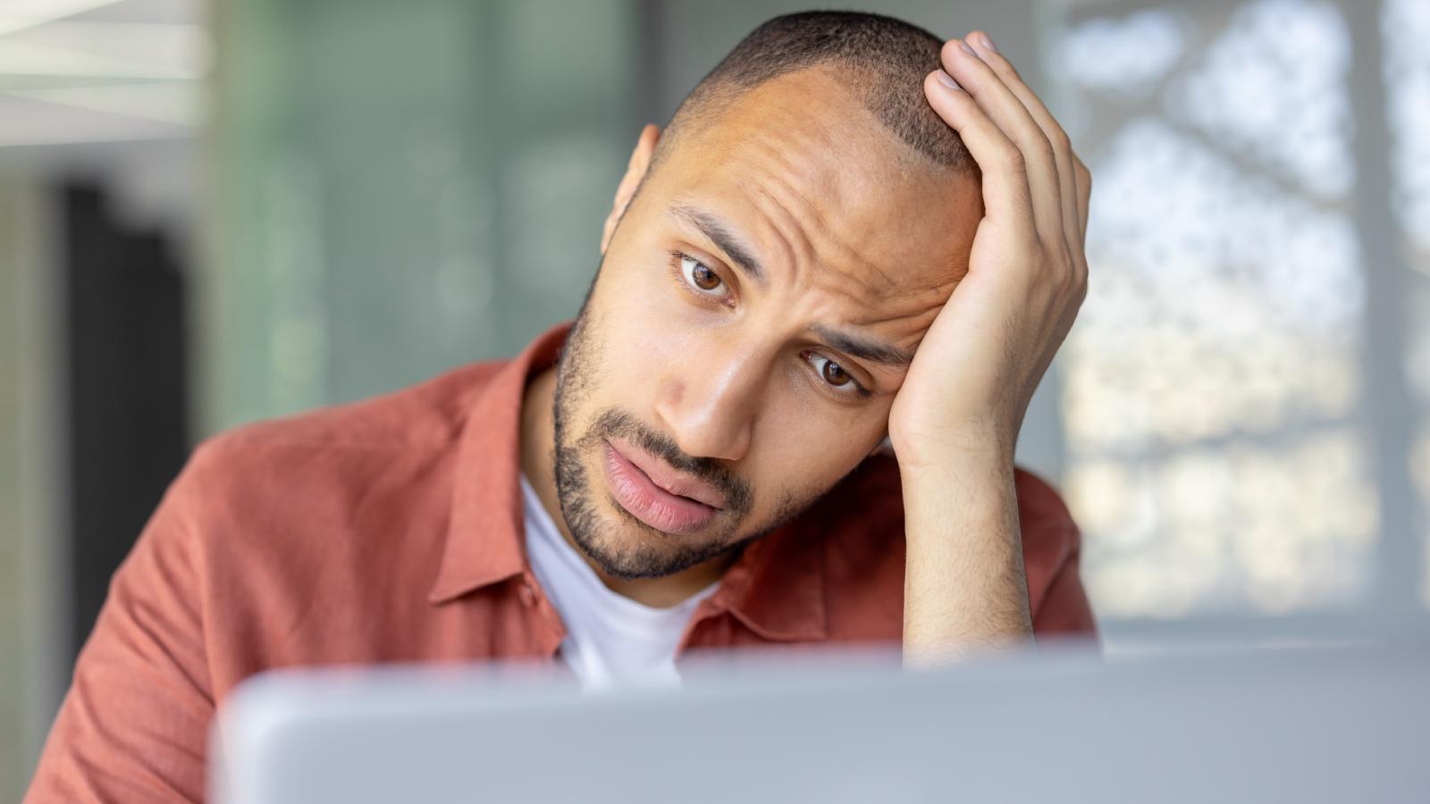 Employee Told They Must “Bring Value” to Get a Raise Sparks Debate: Isn’t Doing My Job Enough? man with an exasperated expression