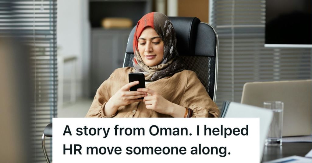 woman sitting on her phone in the office
