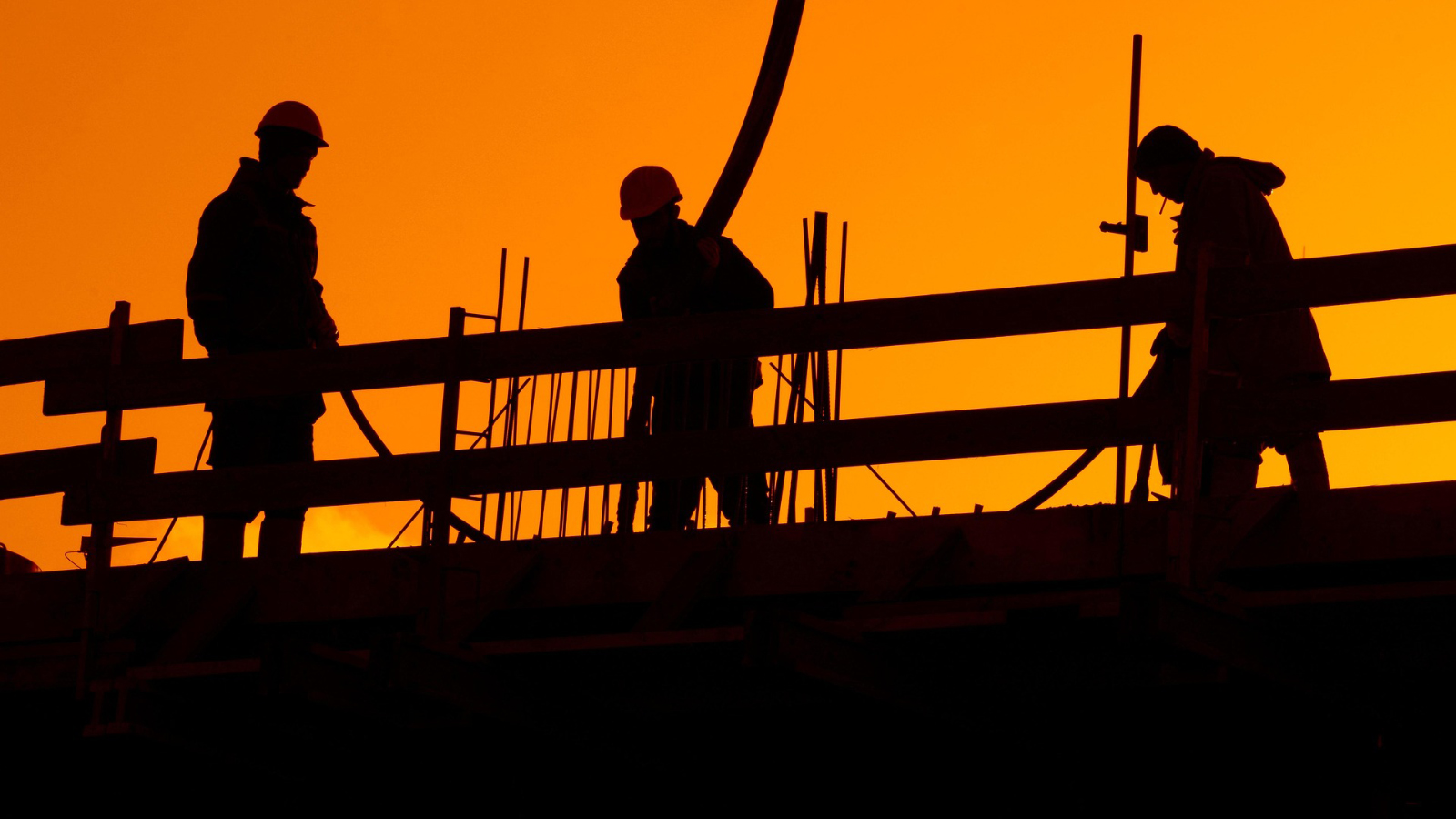 Silhouettes of construction workers