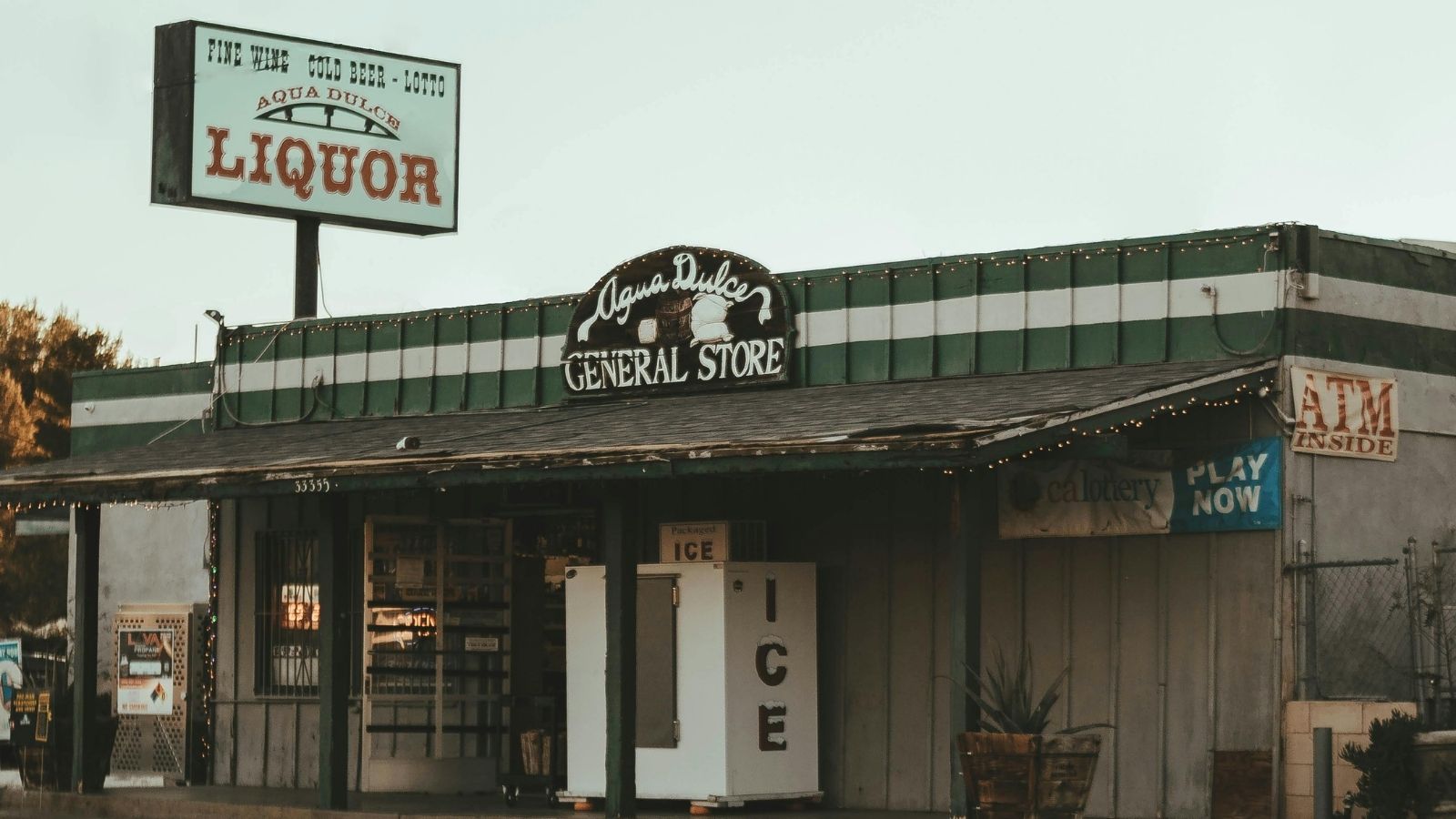 General store with large liquor sign