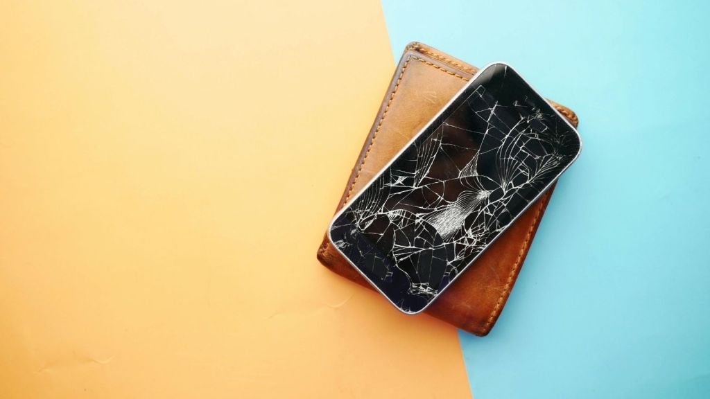 Smashed up iPhone on a wallet