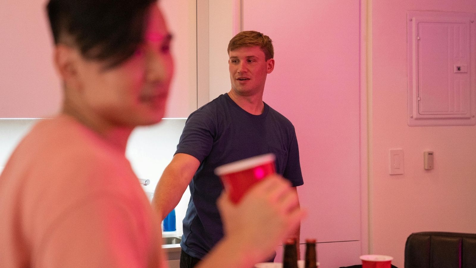 Two guys at a dorm party