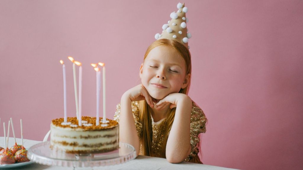 A girl with her birthday cake