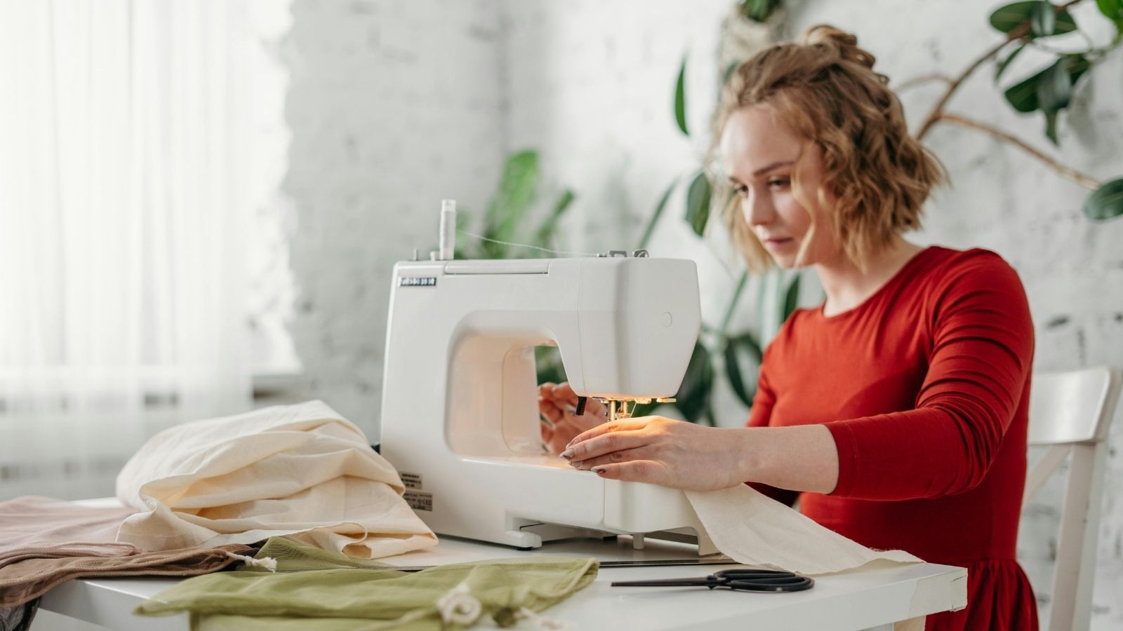A woman using a sewing machine