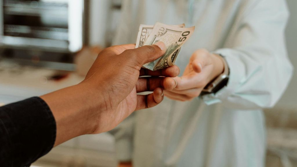 Person paying with a bill