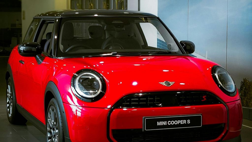Red Mini Cooper S in a showroom