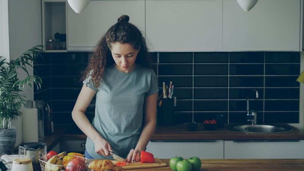 Young woman prepping food in the kitchen