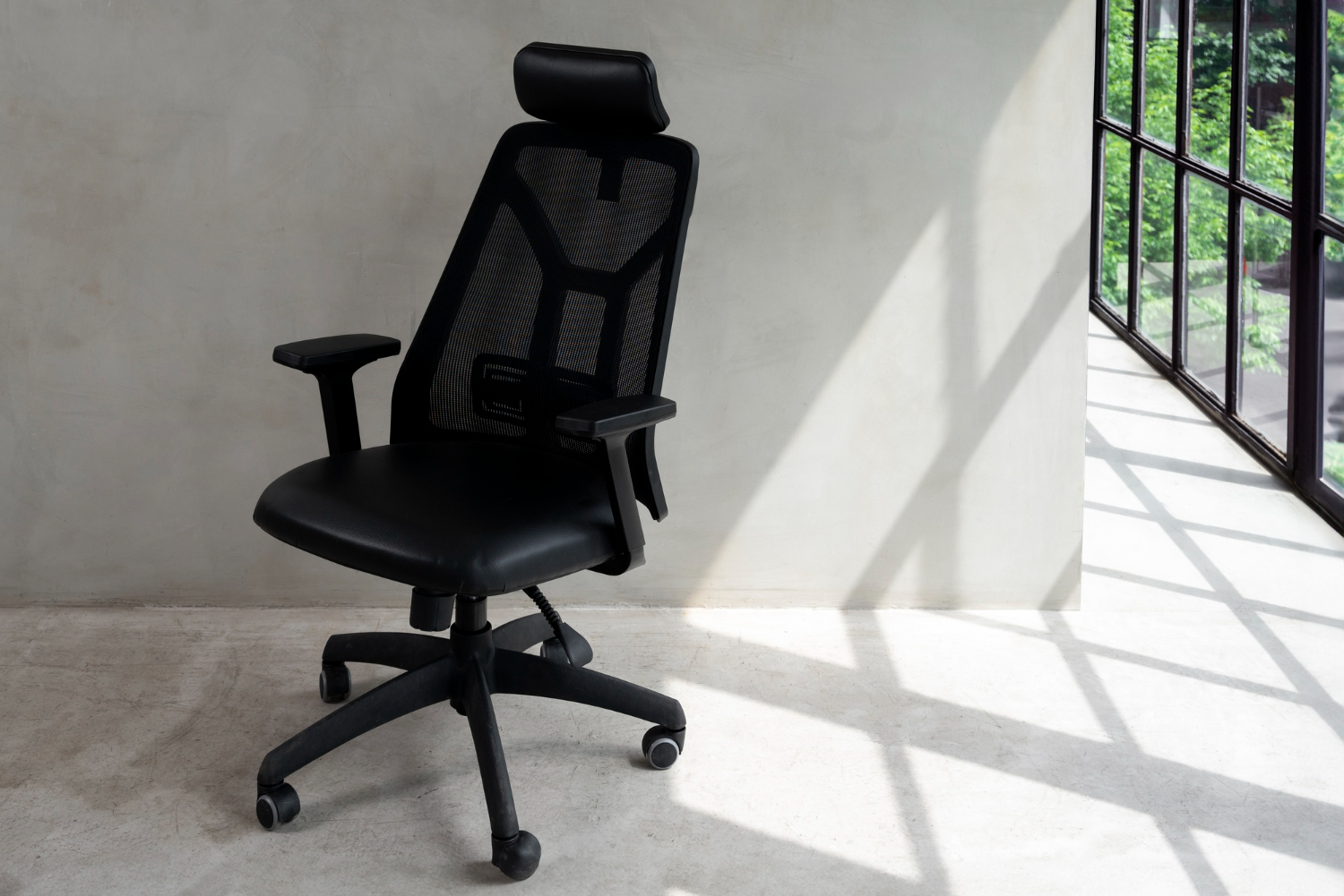 Black office chair by a window