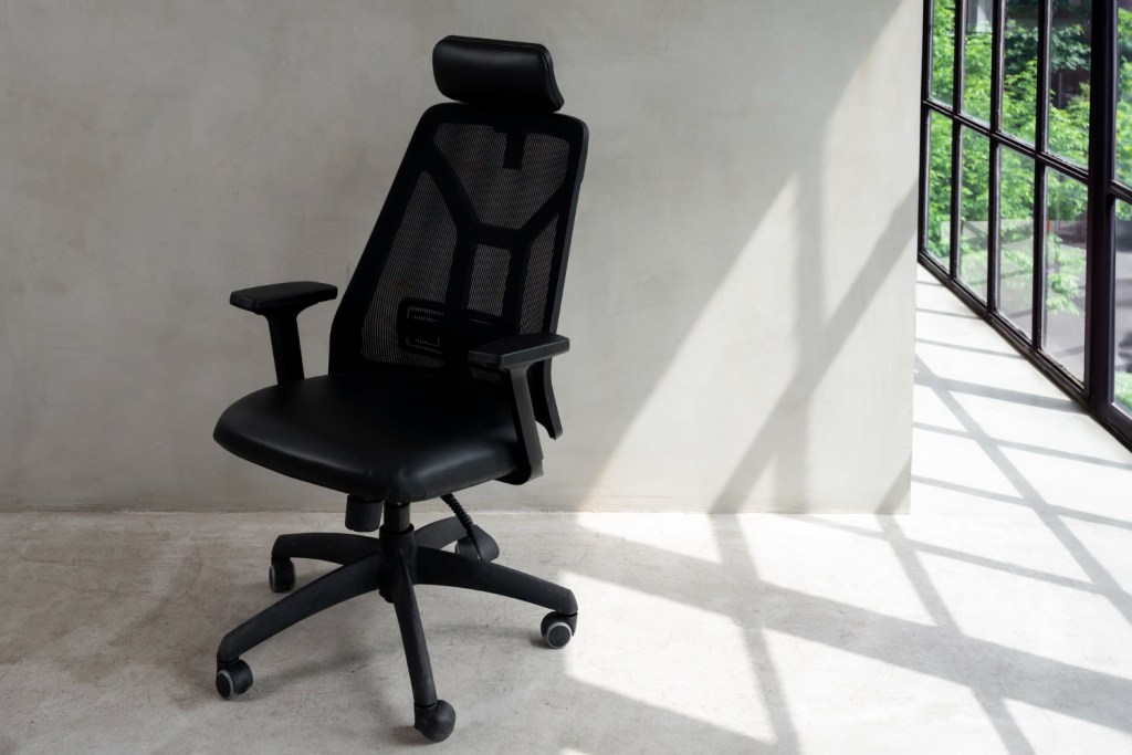 Black office chair by a window