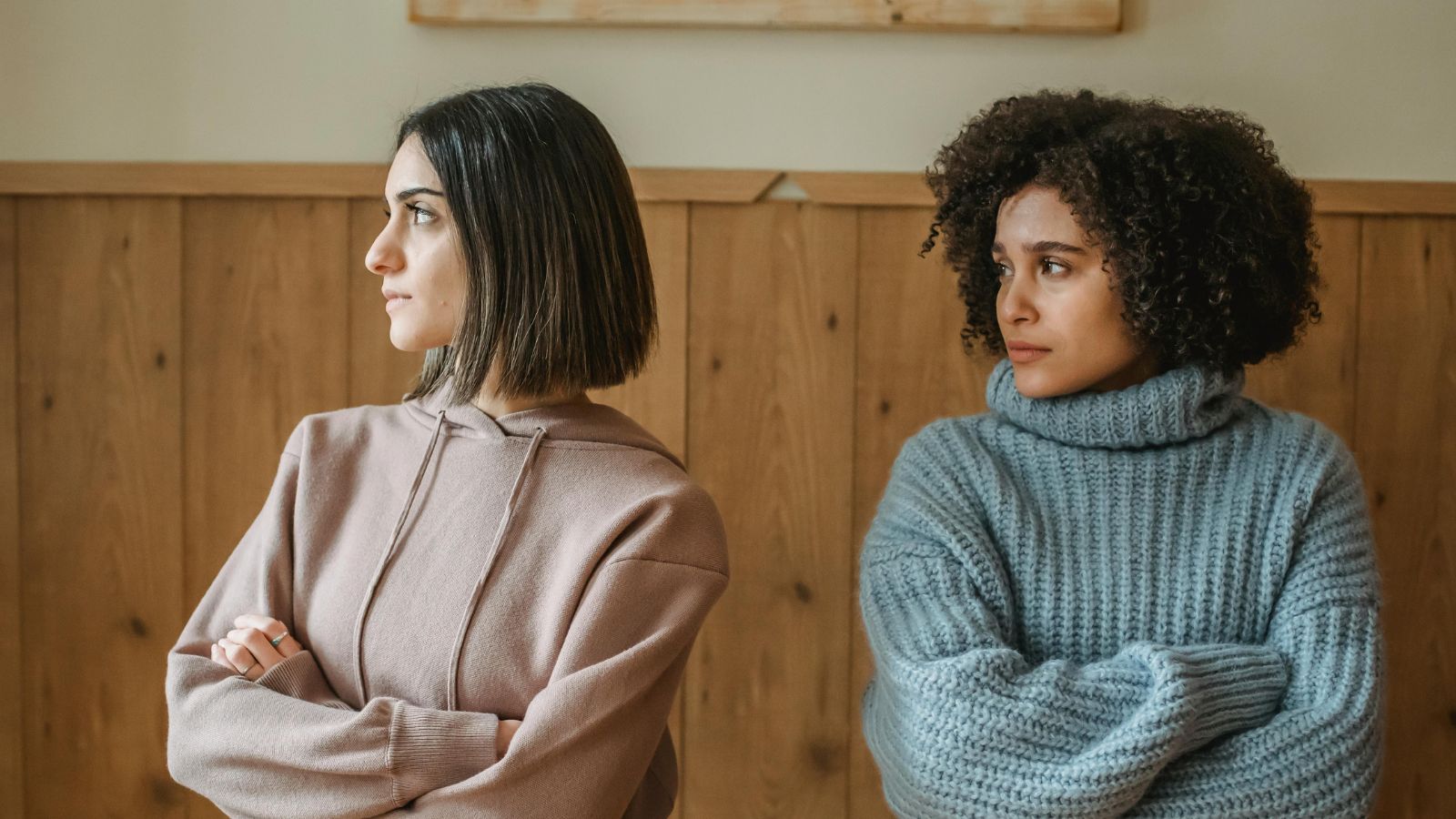 Law Student’s Paris Trip Plans Spark Tension After Friend Wants to Bring Her Boyfriend Two women looking furious and offended.