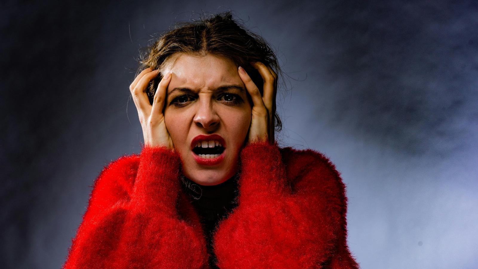 A Boyfriend’s Habit of Vanishing After Fights Pushes One Woman to Her Breaking Point Woman holding her head because her bf is driving her nuts