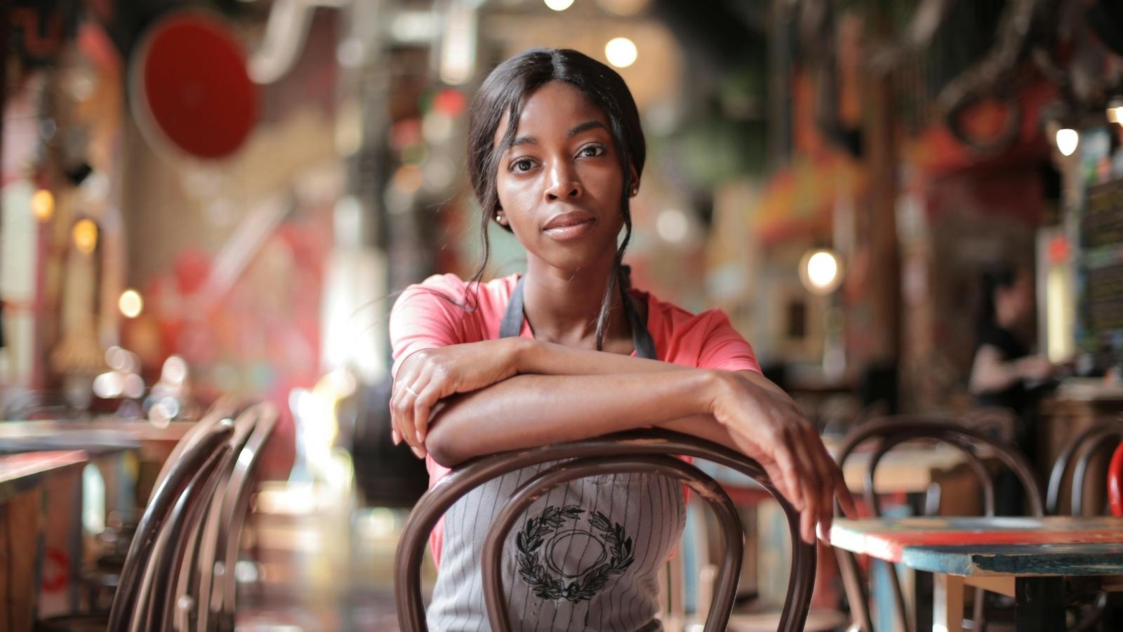 A Packed Holiday Restaurant Shift Fell Apart Near Closing, and Management Blamed the Wrong Person Waitress sitting in a chair after a long, stressful shift