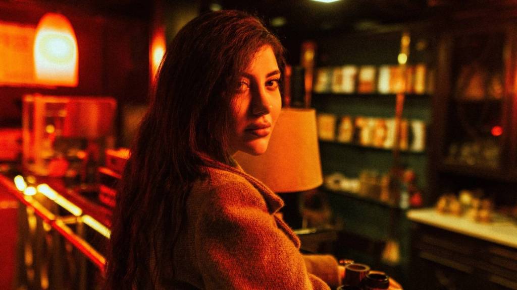Woman with a young face standing at a bar