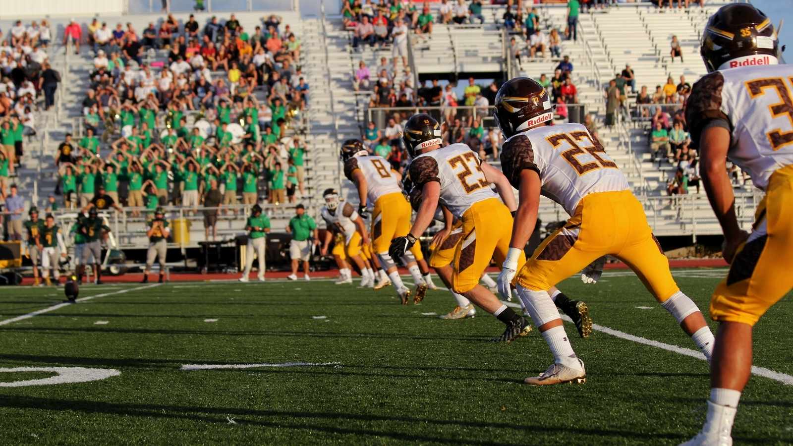 Crowd watching high school football team play