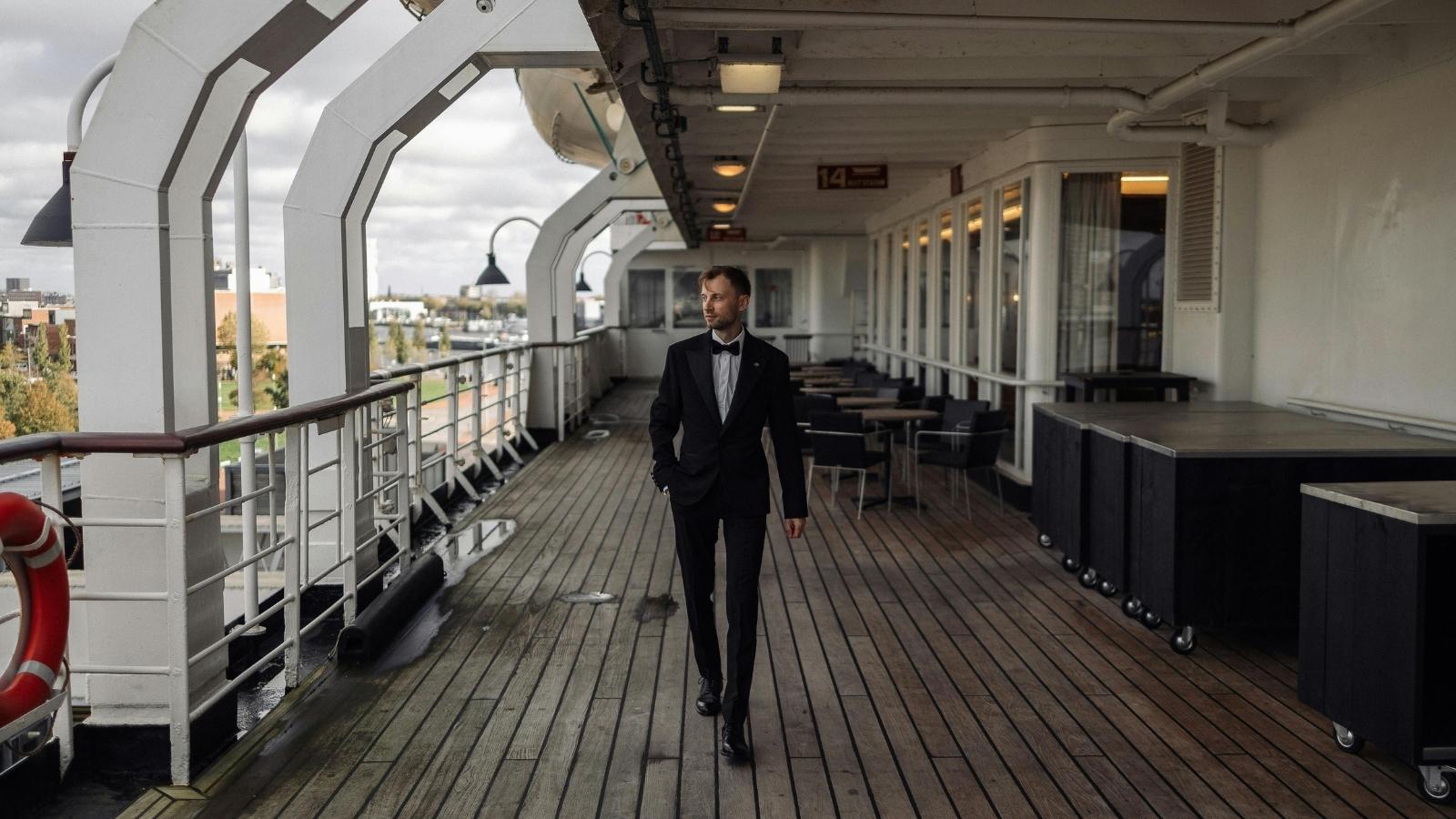 Employee walking on the deck of a cruise ship