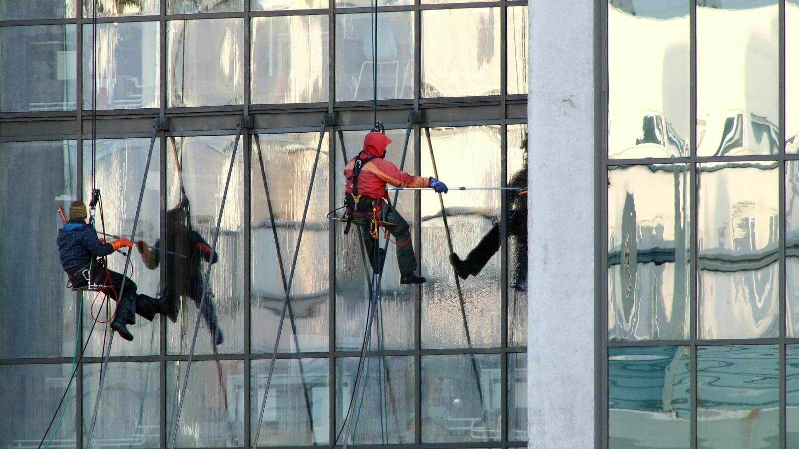 A Routine Cleaning Job Turns Into an Awkward Moment After a Customer Makes an Assumption Window cleaners high up on a building