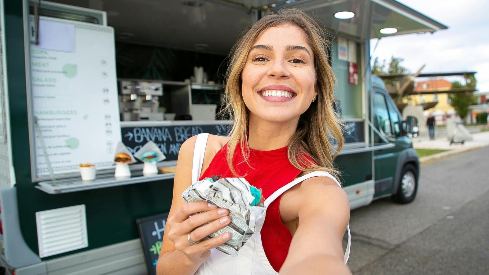 Young woman taking a selfie outside of her job
