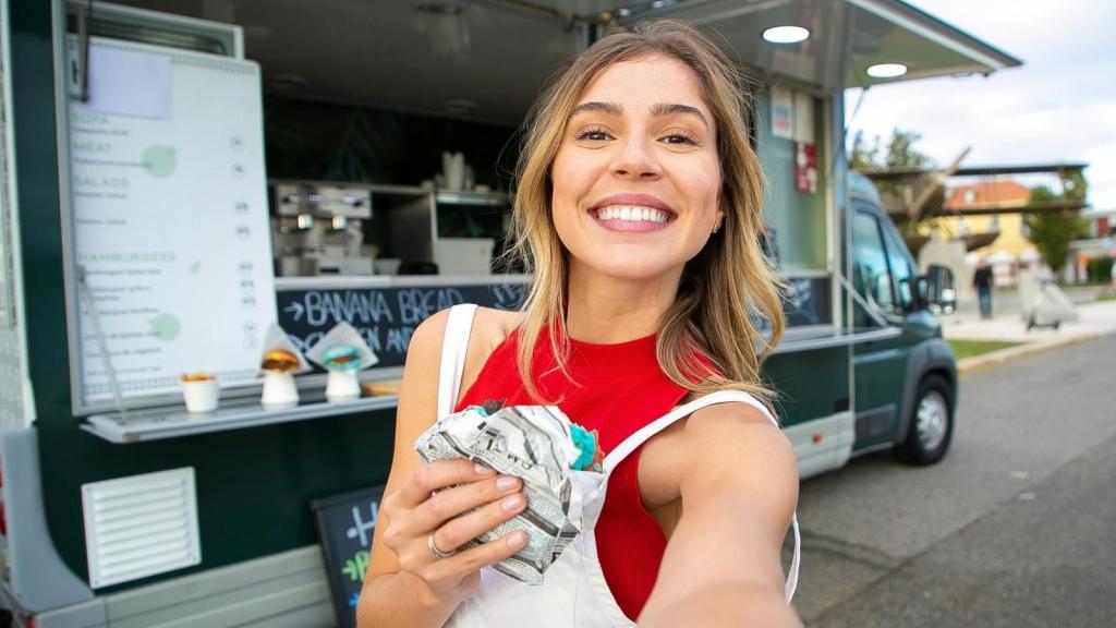 Young woman taking a selfie outside of her job