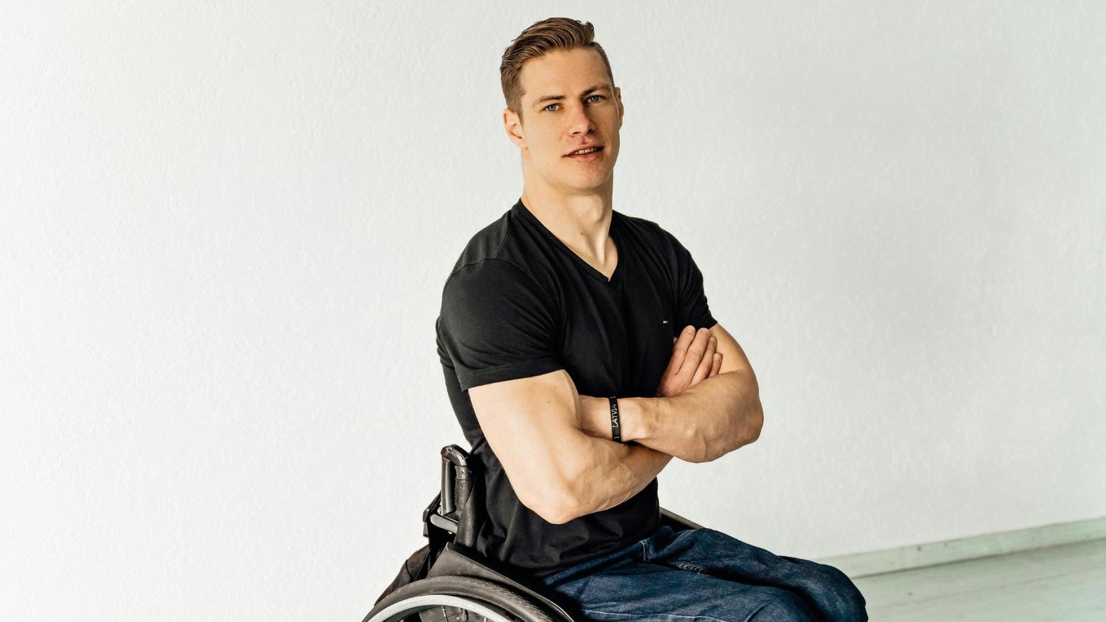 Young man wearing a black shirt in a wheelchair