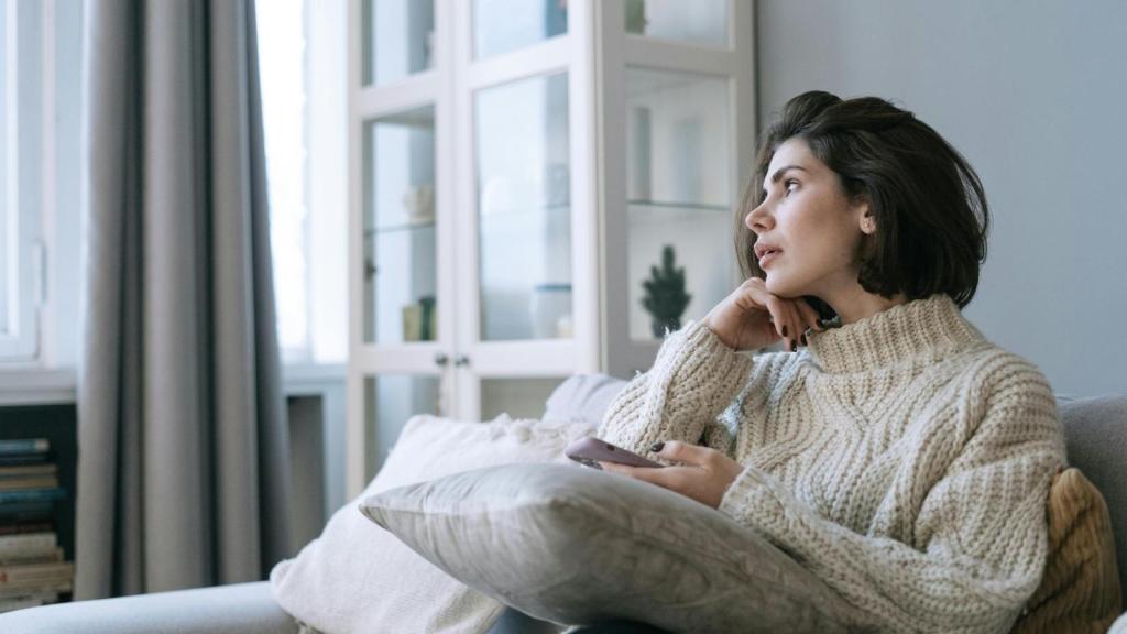 Woman thinking and looking out the window