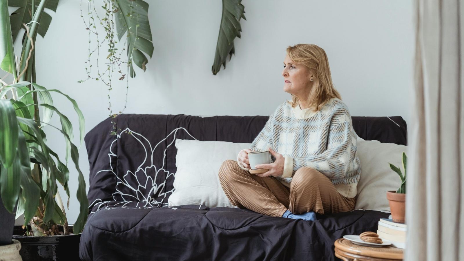 Woman looking out the window thinking about her father