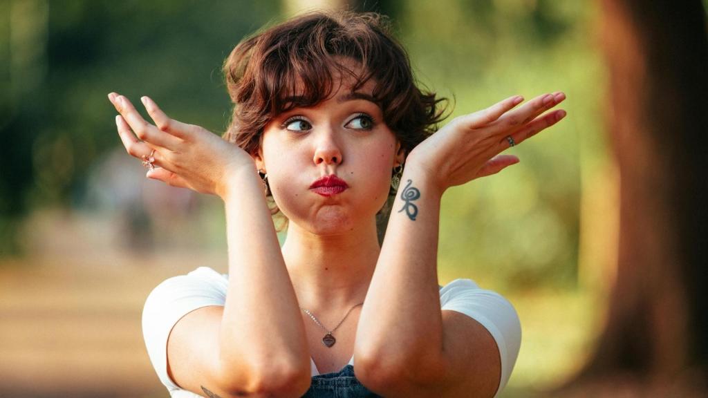 Woman acting cheeky and wondering if she was wrong at work