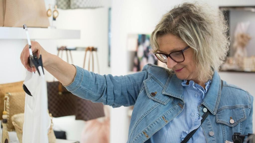 Woman looking at clothes inside a store