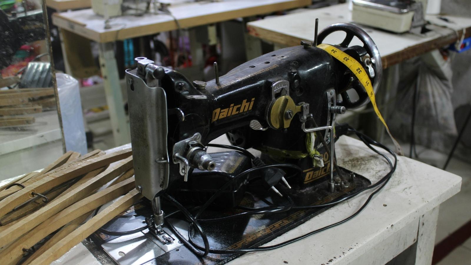 A Customer Tries Bringing a Giant Sewing Table Into a Golf Shop Despite Multiple Warnings Antique sewing machine mounted to a table