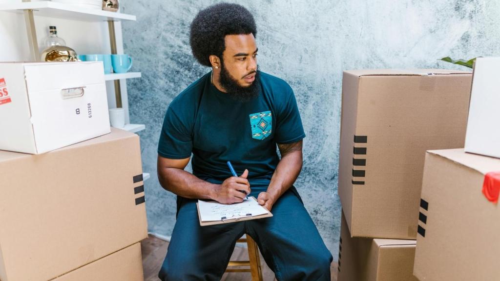 Man checking off every item on a safety check list at work