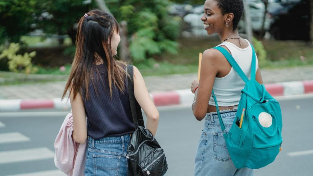 Teen girls walking home after high school