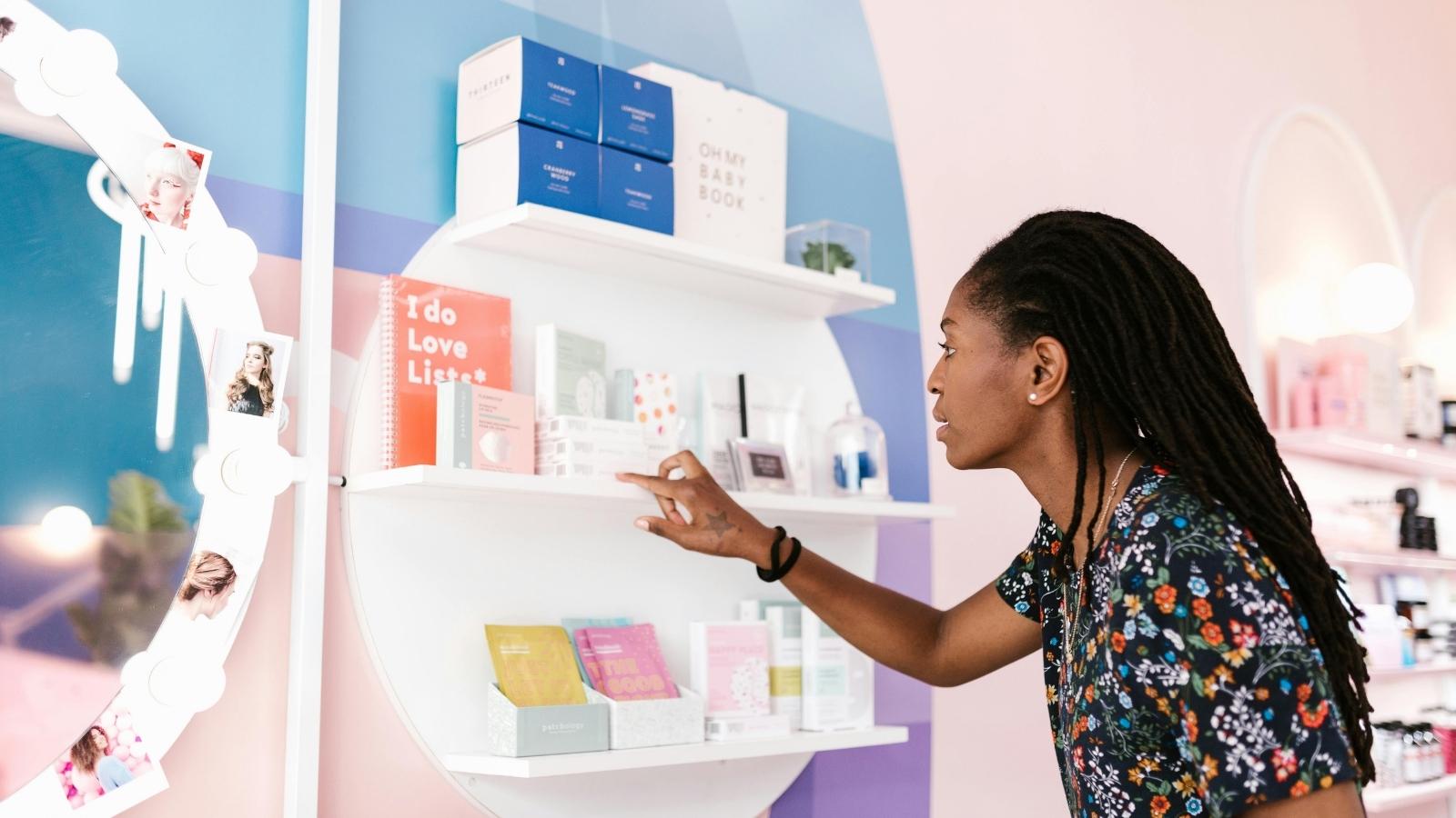Woman looking for a price at a makeup store