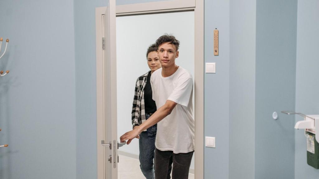 young man walking into doctors office