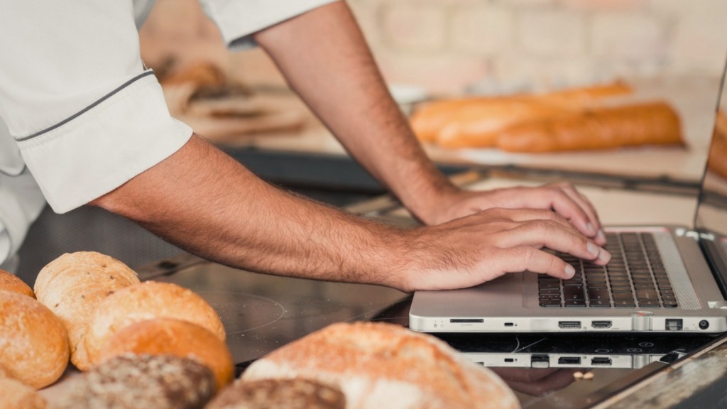 Baker using a laptop