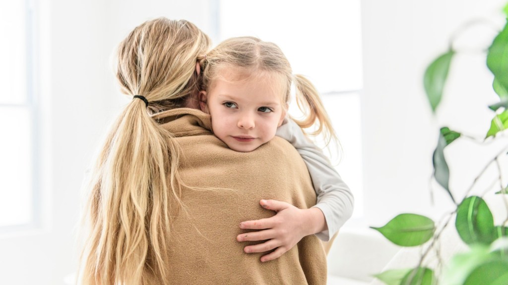 Upset toddler with mom