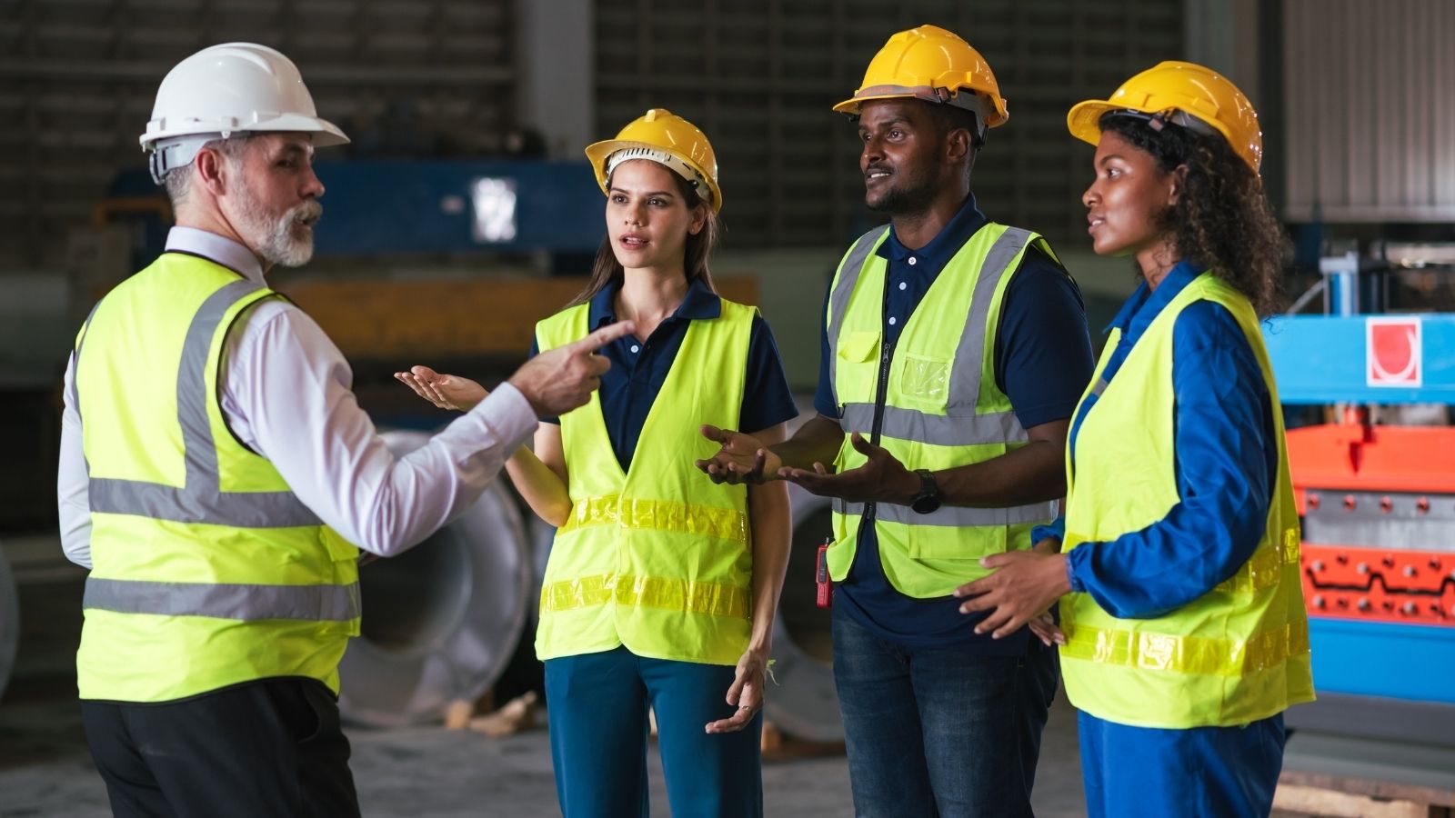 warehouse manager talking to employees
