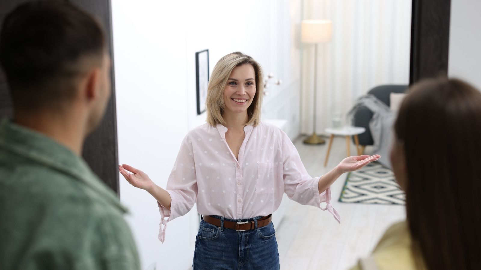 woman welcoming family to her home