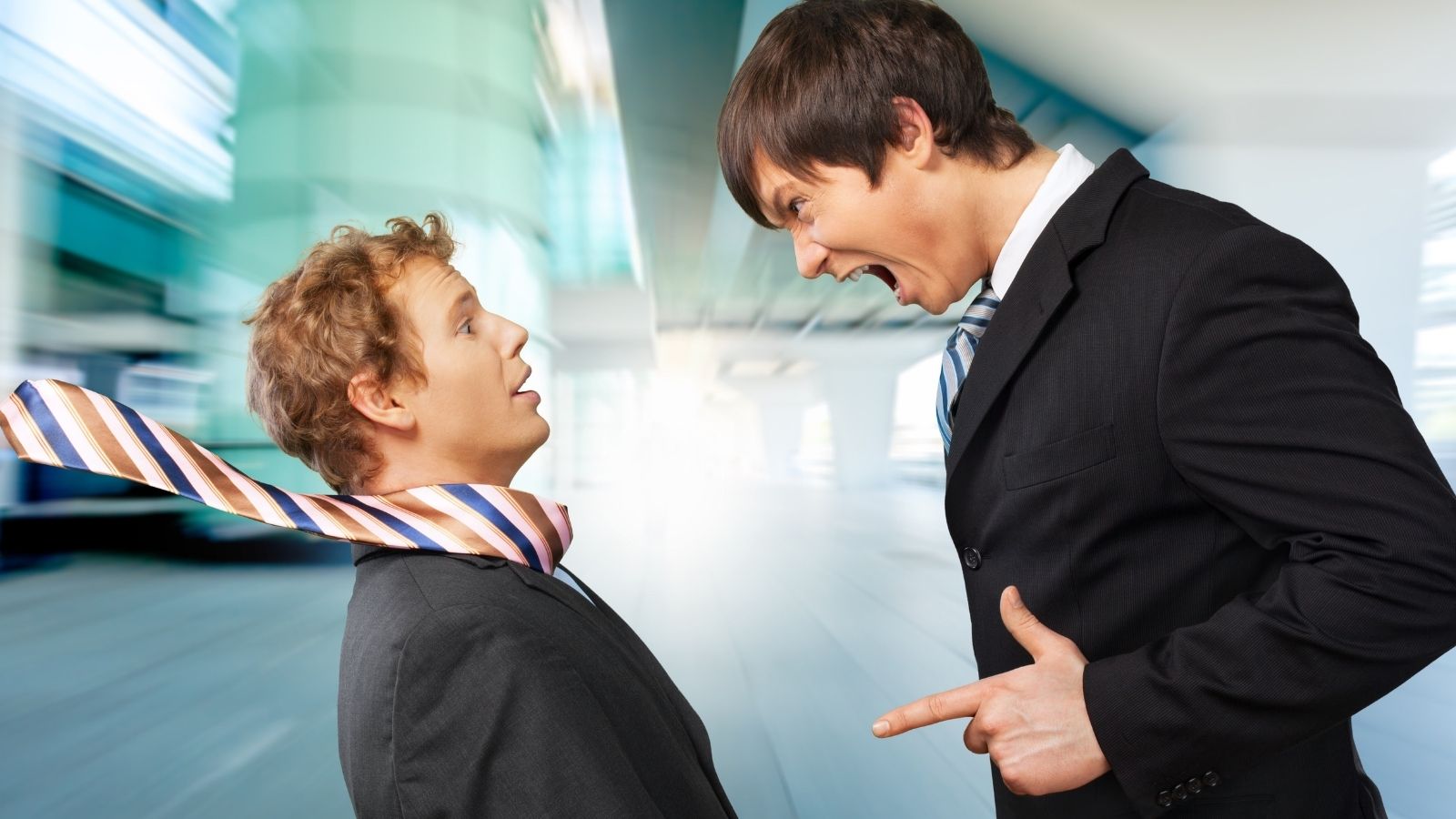 businessman yelling at employee