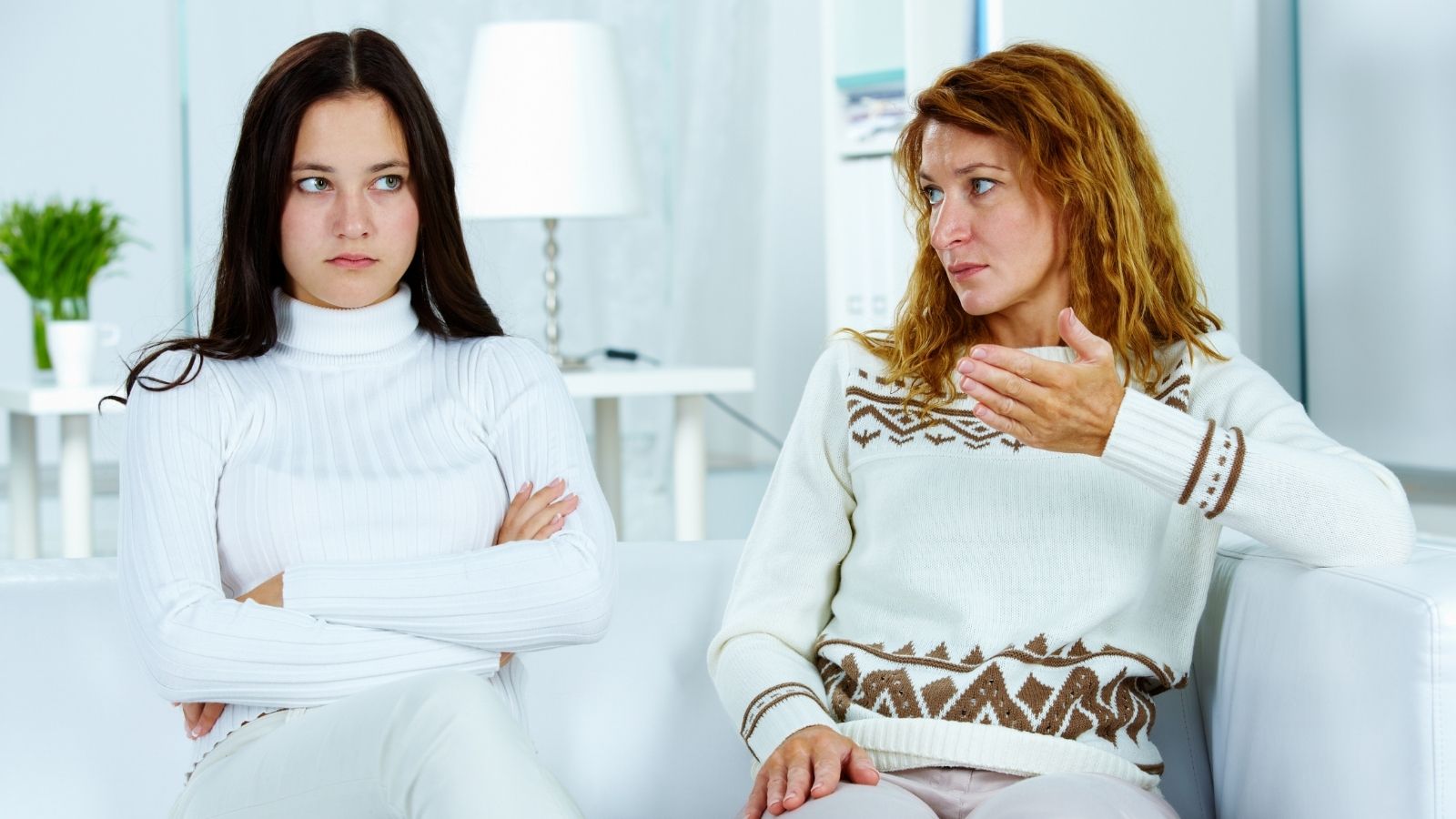 mother talking to her stubborn adult daughter